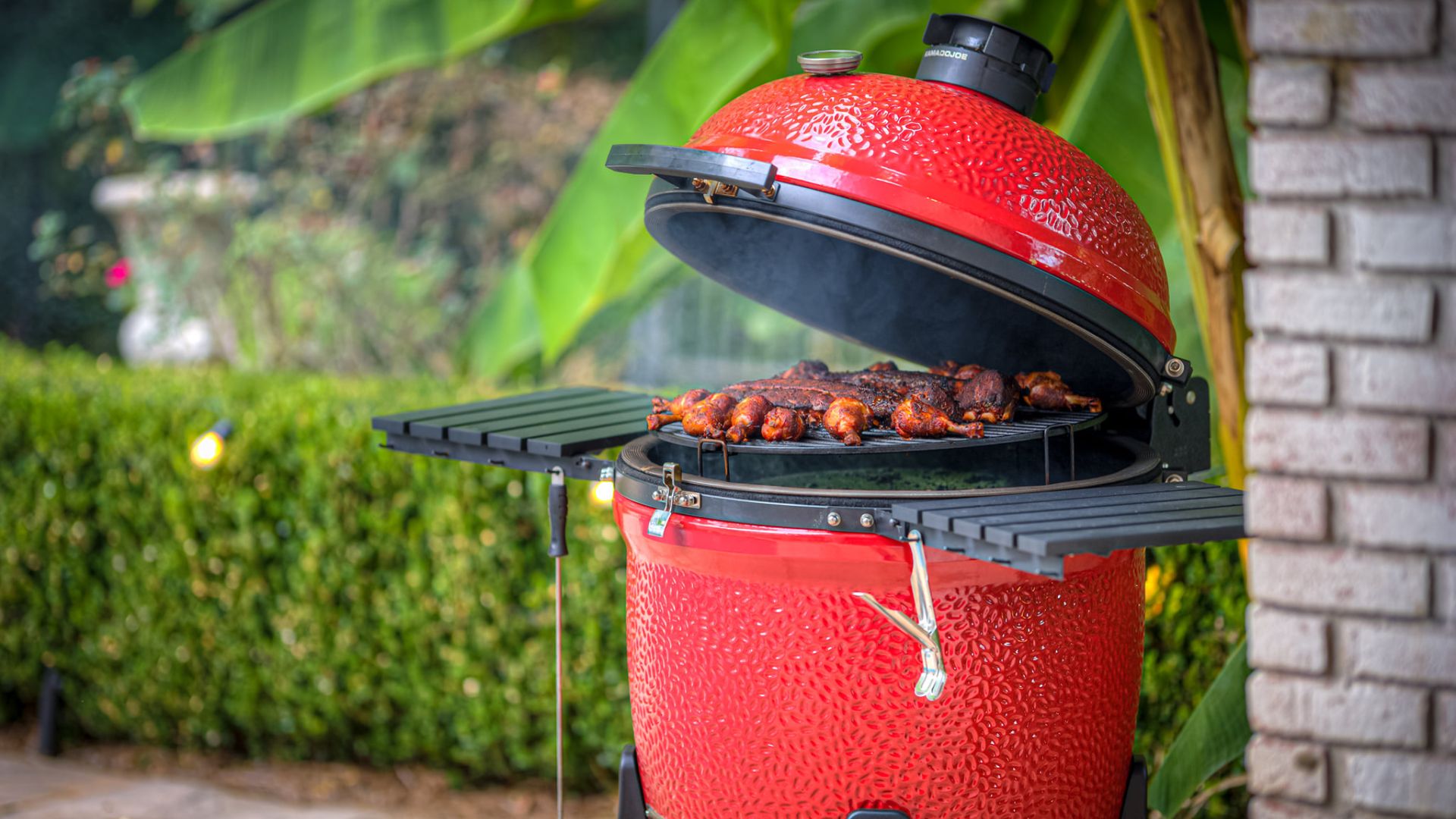 A red Kamado Joe grill