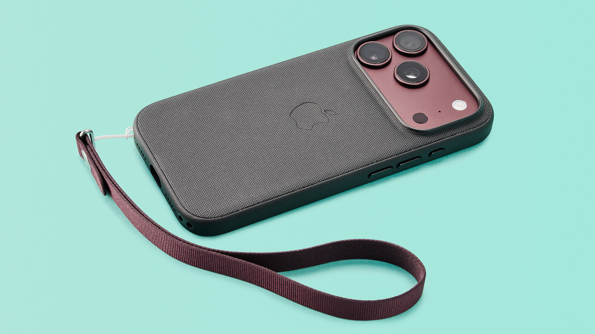 Apple iPhone 18 Pro in burgundy on green background