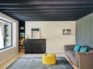 living room with black ceiling by Sarah Jefferys