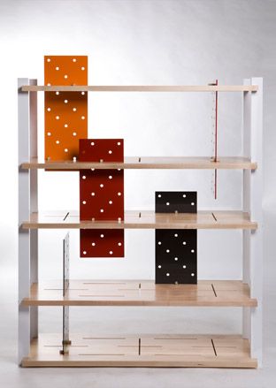 Wooden shelving unit with colourful backing