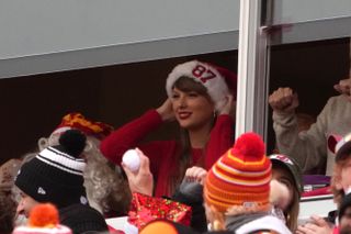 Taylor Swift cheering Travis Kelce on during a Christmas Day game in 2023.