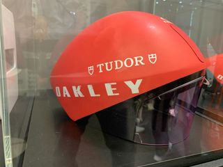 New Oakley Helmets in red pictured in glass case