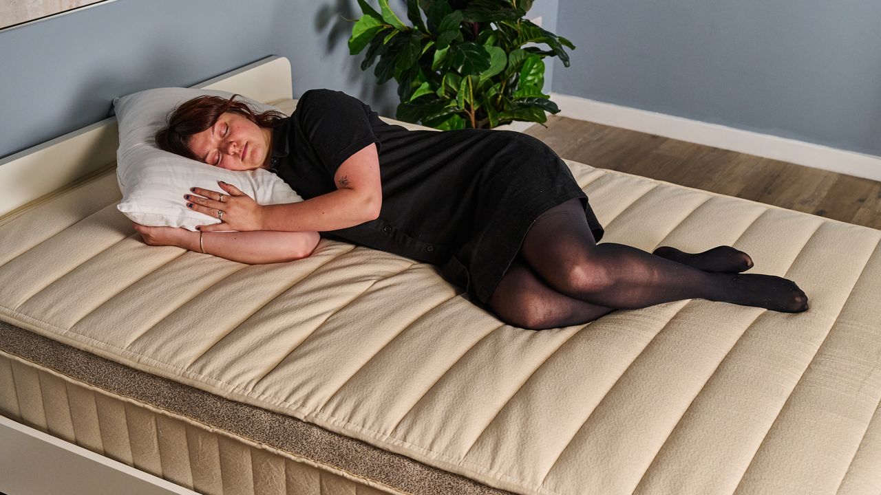 A Tom's Guide tester sleeping on her side on the Birch Luxe Natural