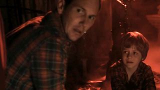 Ty Simpkins and Patrick Wilson looking scared in Insidious. 