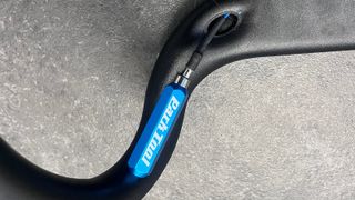 Bike tool in use on internal cabling of bike