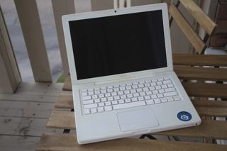 White Macbook Open Table