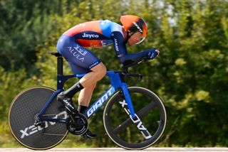 A Jayco AlUla rider on a Giant time trial bike