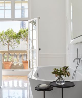 bathroom with bath and French windows and view of Eiffel Tower