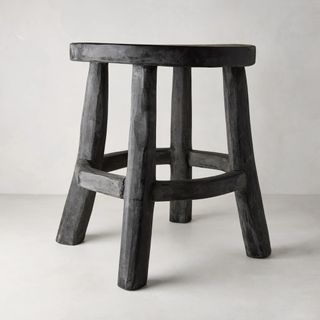 Black stool made of reclaimed wood 