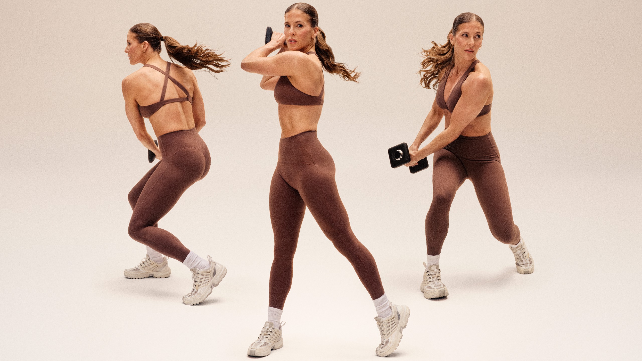 A composite image shows three versions of Peloton instructor Rebecca Kennedy holding a dumbbell in various positions as she executes a dumbbell woodchop. 
