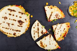 Quesadillas with corn and red bell pepper cut into wedges