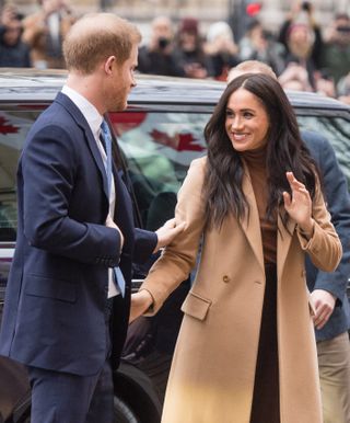 Prince Harry and Meghan Markle visit Canada House London 2020 with Meghan wearing a camel-coloured jacket
