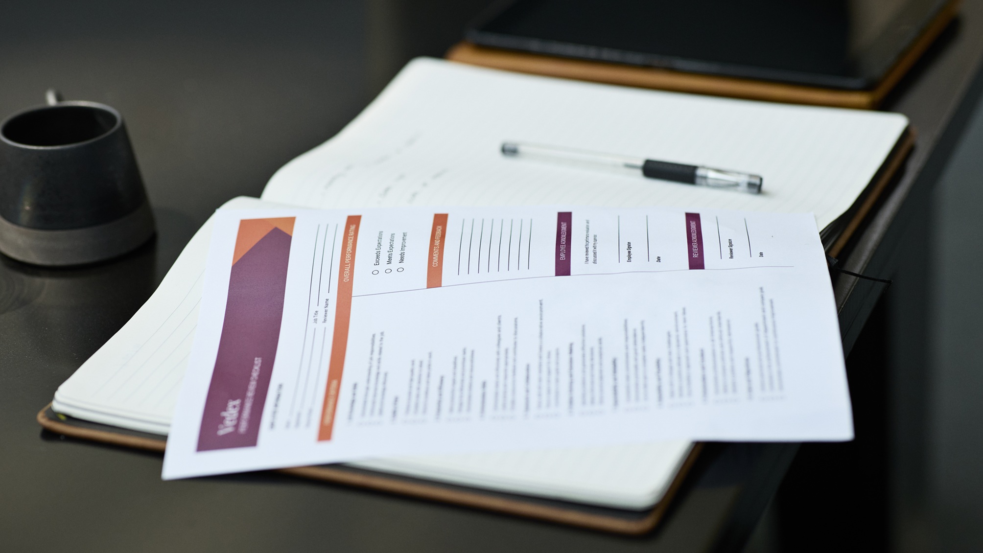 A document that looks like a company's annual report sits open on a table.