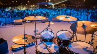 View from behind a drum kit on stage
