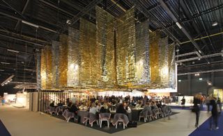Seating area with large gold decorative ceiling decorations