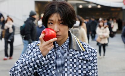 Miu Miu Tales &amp; Tellers film still, person holding apple to face