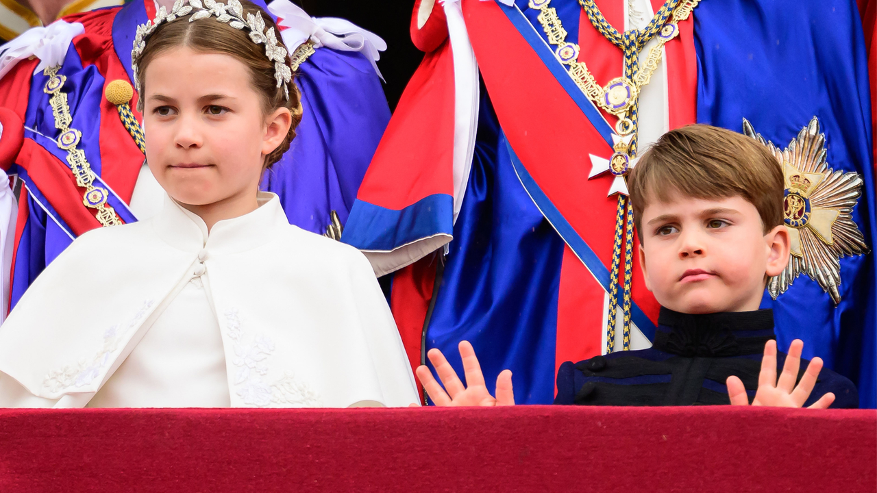 Britain&#039;s Princess Charlotte of Wales and Britain&#039;s Prince Louis of Wales stand on the Buckingham Palace balcony as they wait for the Royal Air Force fly-past in central London on May 6, 2023, after the coronations of King Charles III and Queen Camilla. - The set-piece coronation is the first in Britain in 70 years, and only the second in history to be televised. Charles will be the 40th reigning monarch to be crowned at the central London church since King William I in 1066. Outside the UK, he is also king of 14 other Commonwealth countries, including Australia, Canada and New Zealand. Camilla, his second wife, was crowned Queen alongside him.