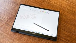 Acer TravelMate Spin P6 on table in dining room