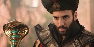 Aladdin Jafar using his staff to enchant a victim