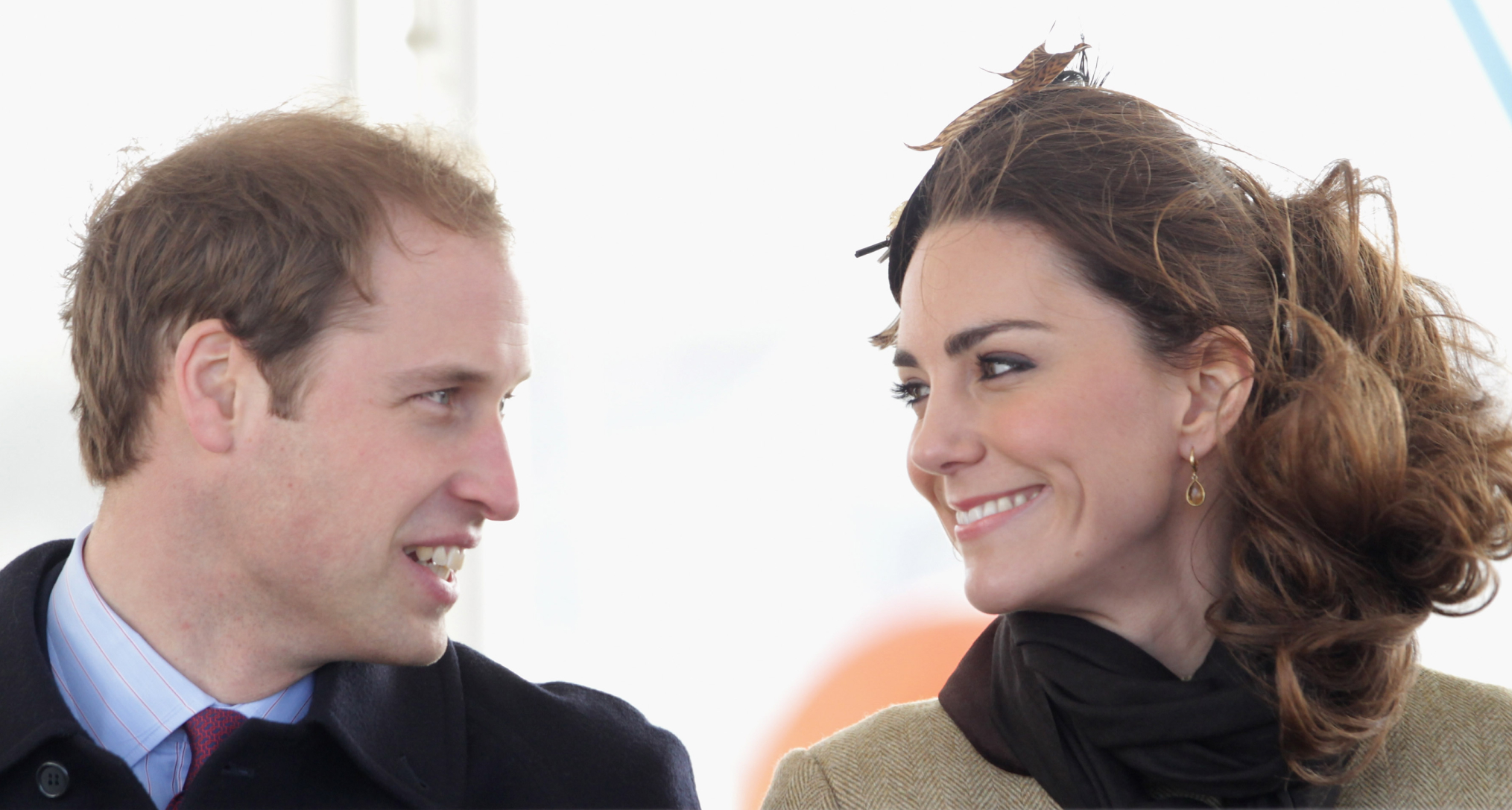 Kate Middleton and Prince William smiling at each other in 2011