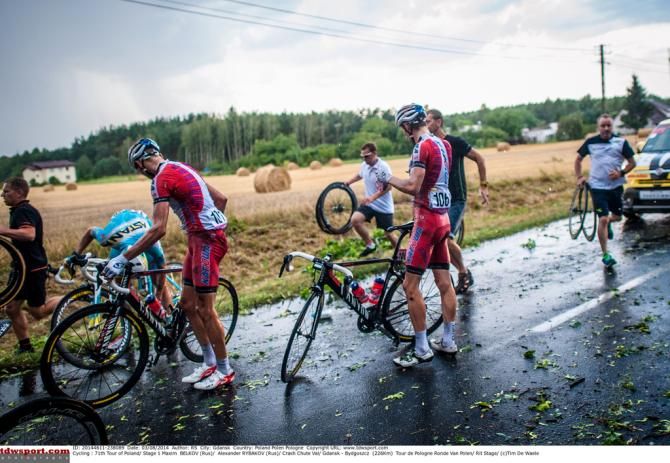 Katusha riders get back on their bikes after the mass-crash