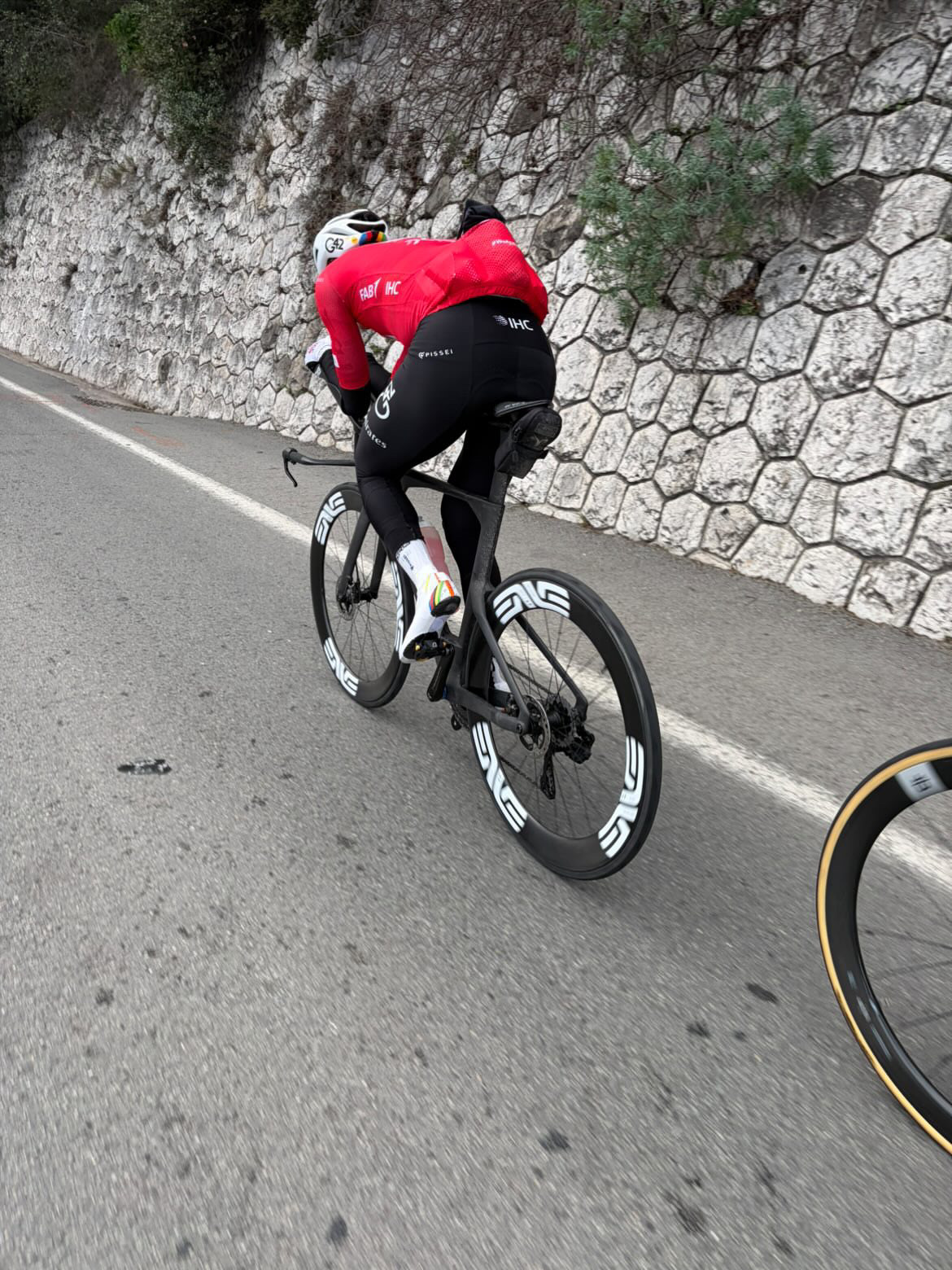 Tadej Poga&amp;#269;ar riding a unmarked time trial bike