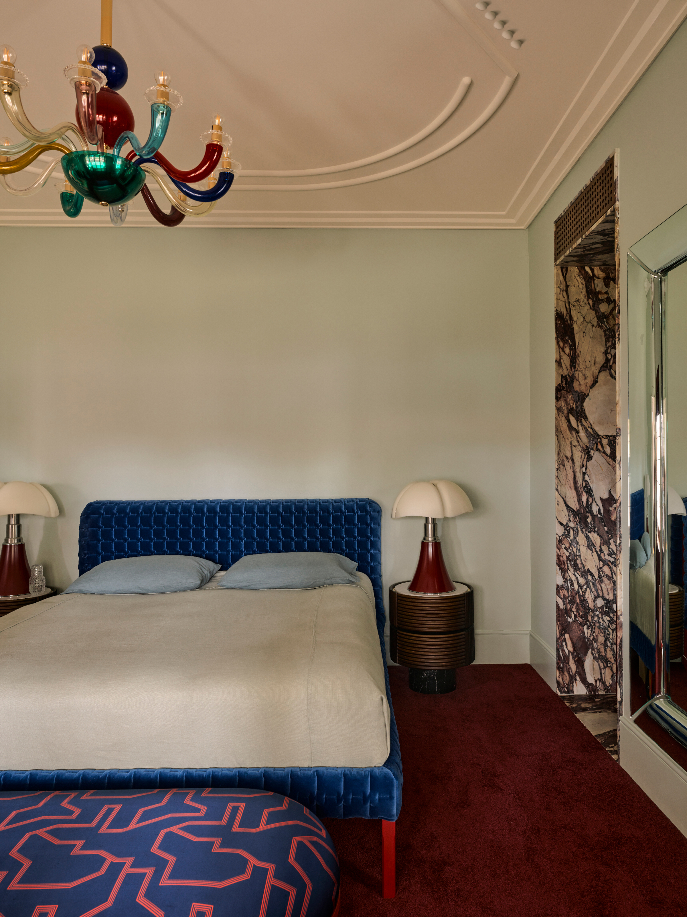 Mint green bedroom with blue bed