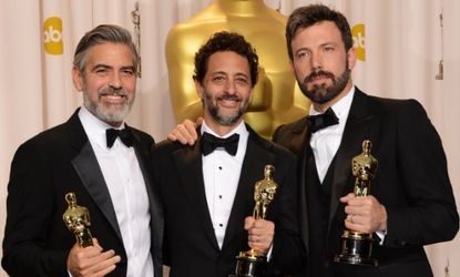 Producers George Clooney and Grant Heslov and actor-producer-director Ben Affleck celebrate their Best Picture win for Argo.