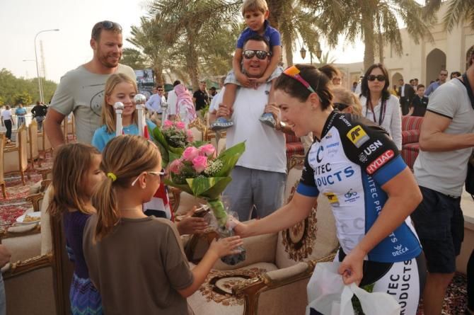 Chloe Hosking signs autographs for fans at the Ladies Tour of Qatar