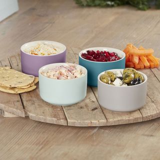 multi colour ramekins dishes with wooden serving board