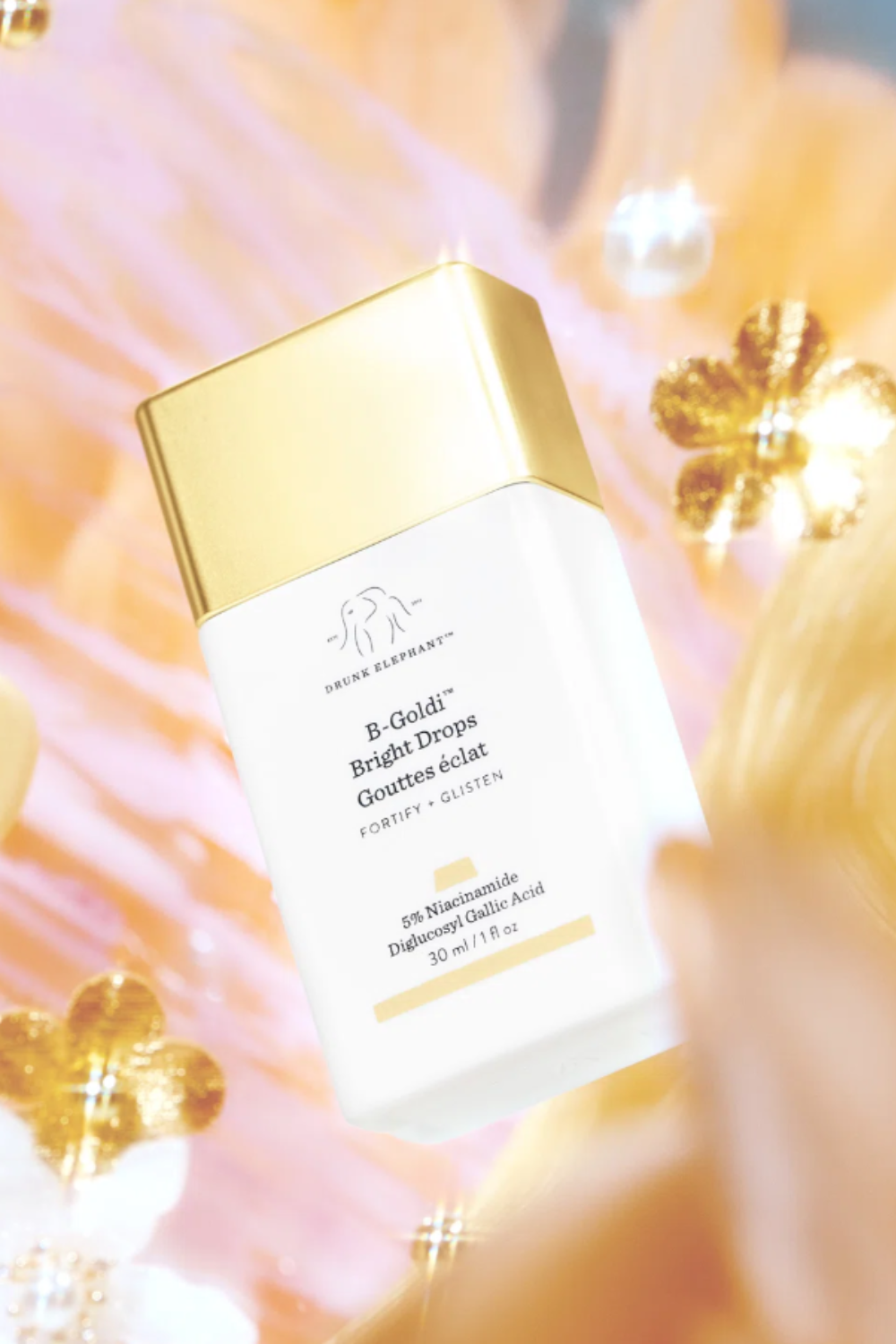 b-goldi drops with a sparkly background