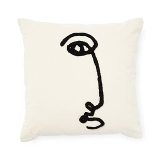 white cushion with face