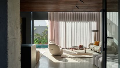 living room with pink curtain at Villa XY by Mohamed Amine Siana