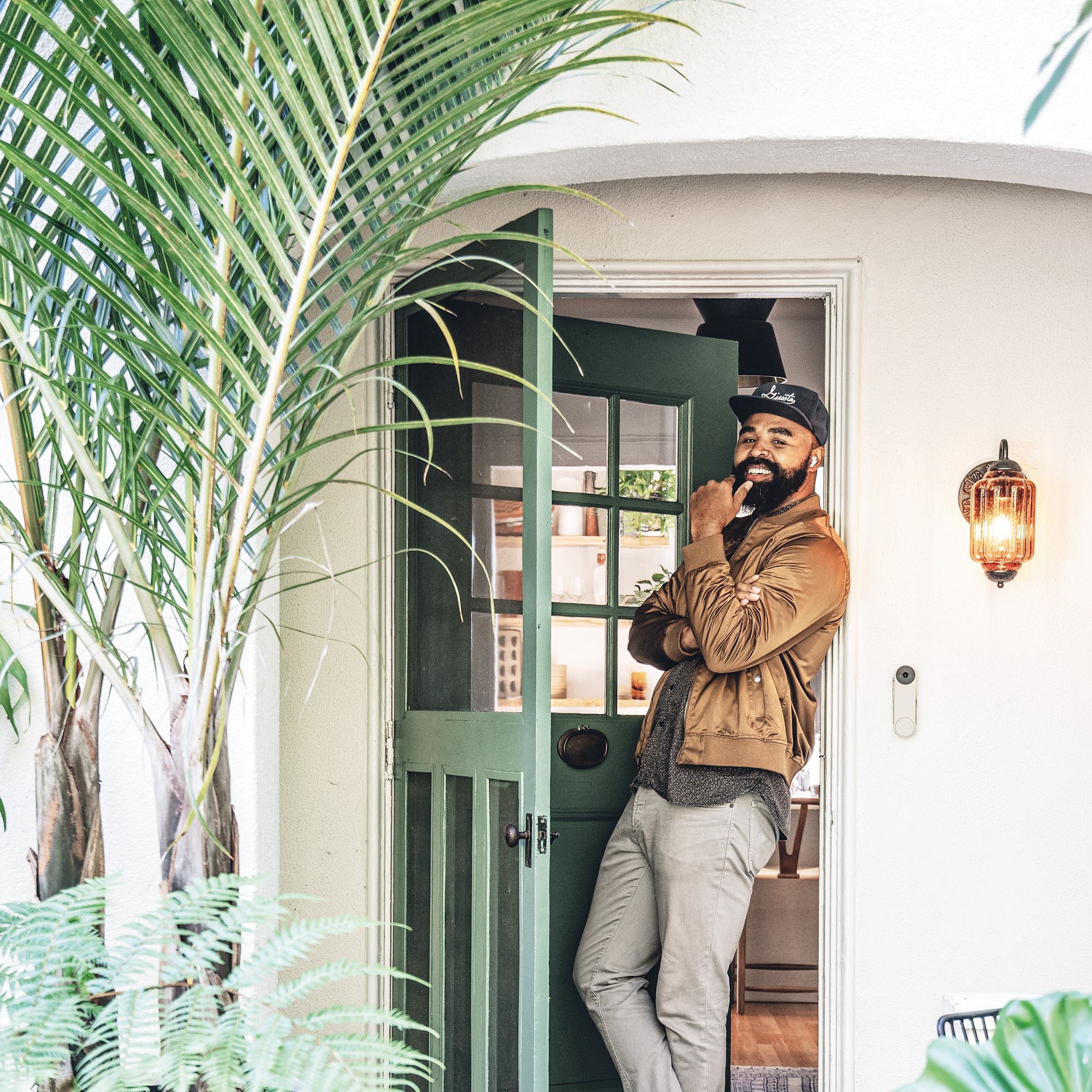 Hilton Carter stood in doorway against a white wall