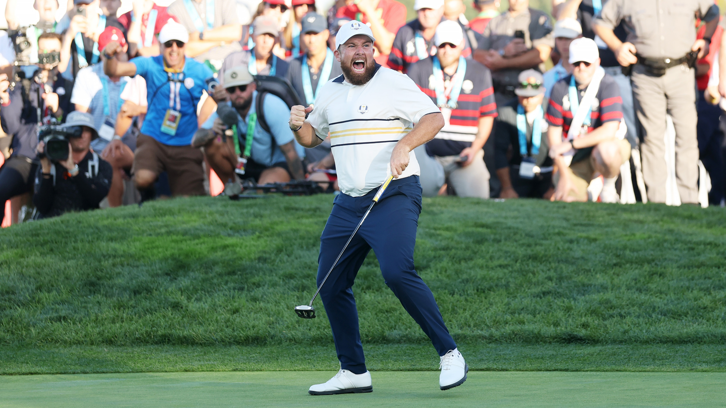 Shane Lowry celebrates holding the clinching putt for Team Europe at the 2025 Ryder Cup