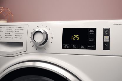 hotpoint washing symbols on machine dial close up