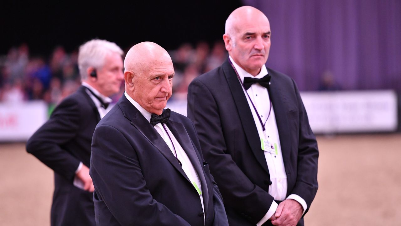 Edwin Prosser and Tullis Matson are seen dressed in tuxedos while judging at HOYS