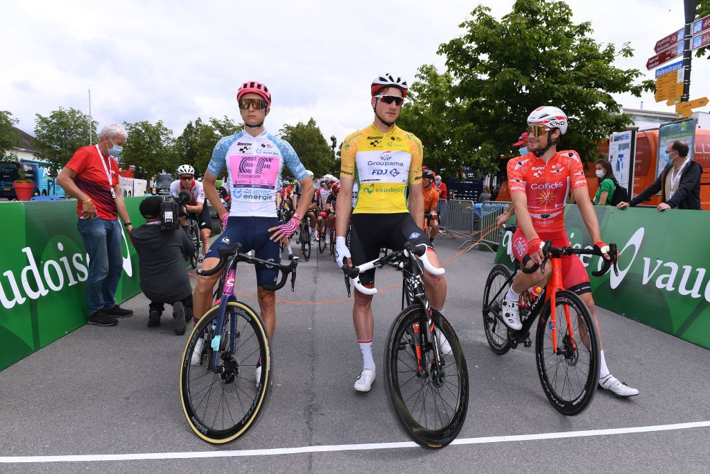PFAFFNAU SWITZERLAND JUNE 08 Neilson Powless of United States and Team EF Education Nippo White Best Young Rider Jersey Stefan Kng of Switzerland and Team Groupama FDJ Yellow Leader Jersey Tom Bohli of Switzerland and Team Cofidis Orange Mountain Jersey at start in Lachen City during the 84th Tour de Suisse 2021 Stage 3 a 185km stage from Lachen to Pfaffnau 509m UCIworldtour tds tourdesuisse on June 08 2021 in Pfaffnau Switzerland Photo by Tim de WaeleGetty Images