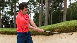 PGA pro Dan Grieve showing a good follow-through position when playing from a bunker with little sand in it