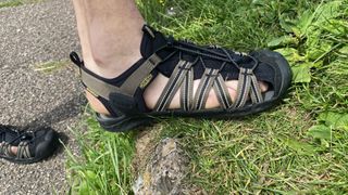 Man wearing Keen Drift Creek H2 sandals on grass