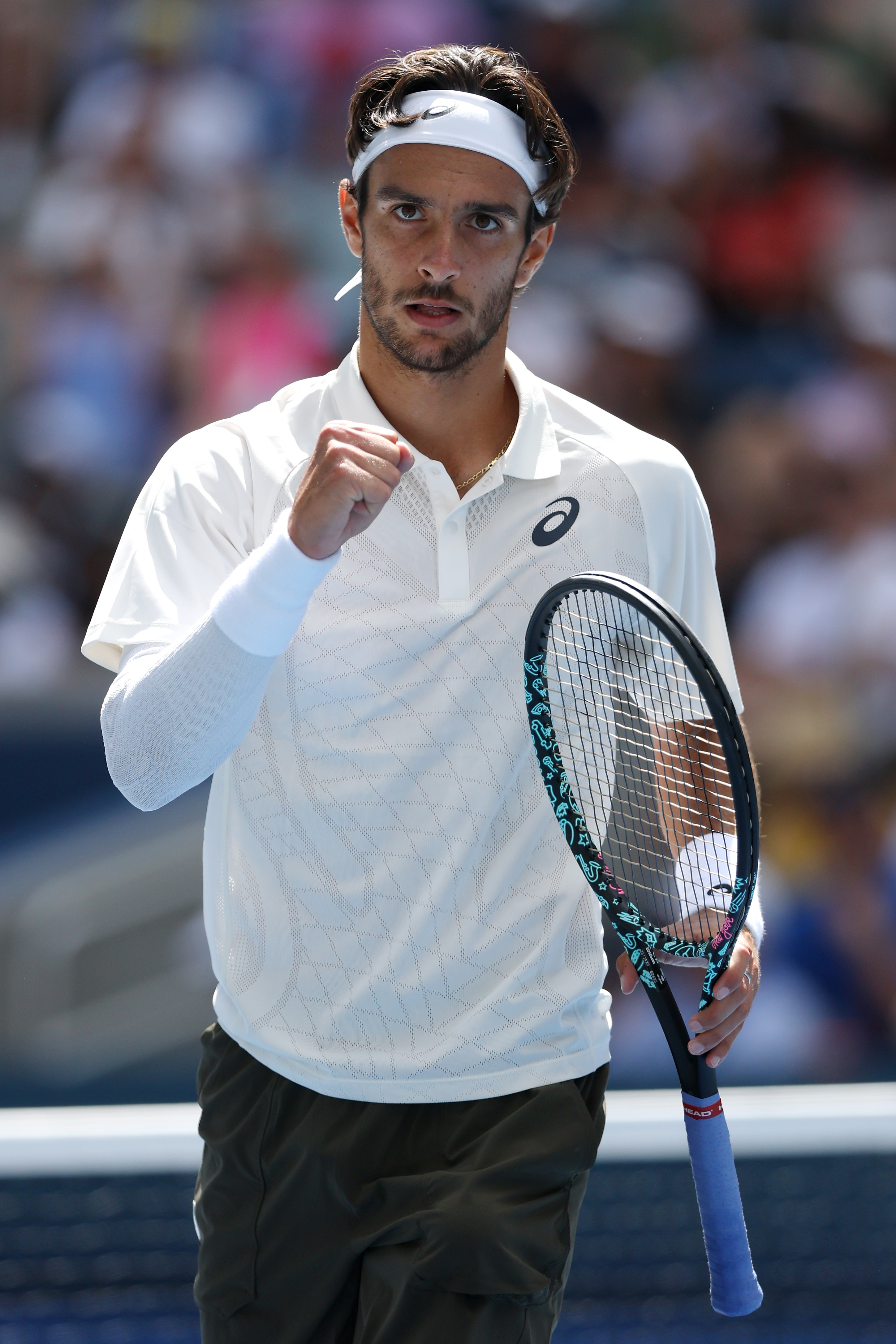 Lorenzo Musetti celebrates match point against Giovanni Mpetshi Perricard during their Men's Singles 1st Round match of the 2025 US Open.