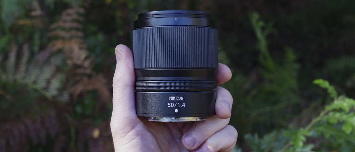 Nikon Z 50mm f/1.4 lens in the hand