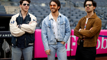 The Jonas Brothers attend the game between the Philadelphia Phillies and the New York Yankees at Yankee Stadium on April 4, 2023 in New York, New York.