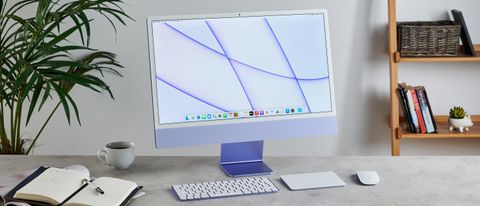 A purple iMac (24-inch, 2021) on a desk