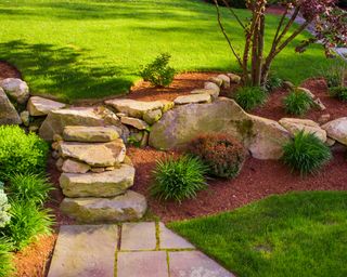 Well landscaped rock stairs and rock wall