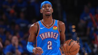Shai Gilgeous-Alexander dribbling with the ball for Oklahoma City Thunder