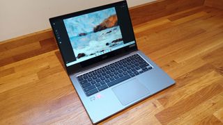 Acer Chromebook Spin 514 review; an open laptop on a wooden bench