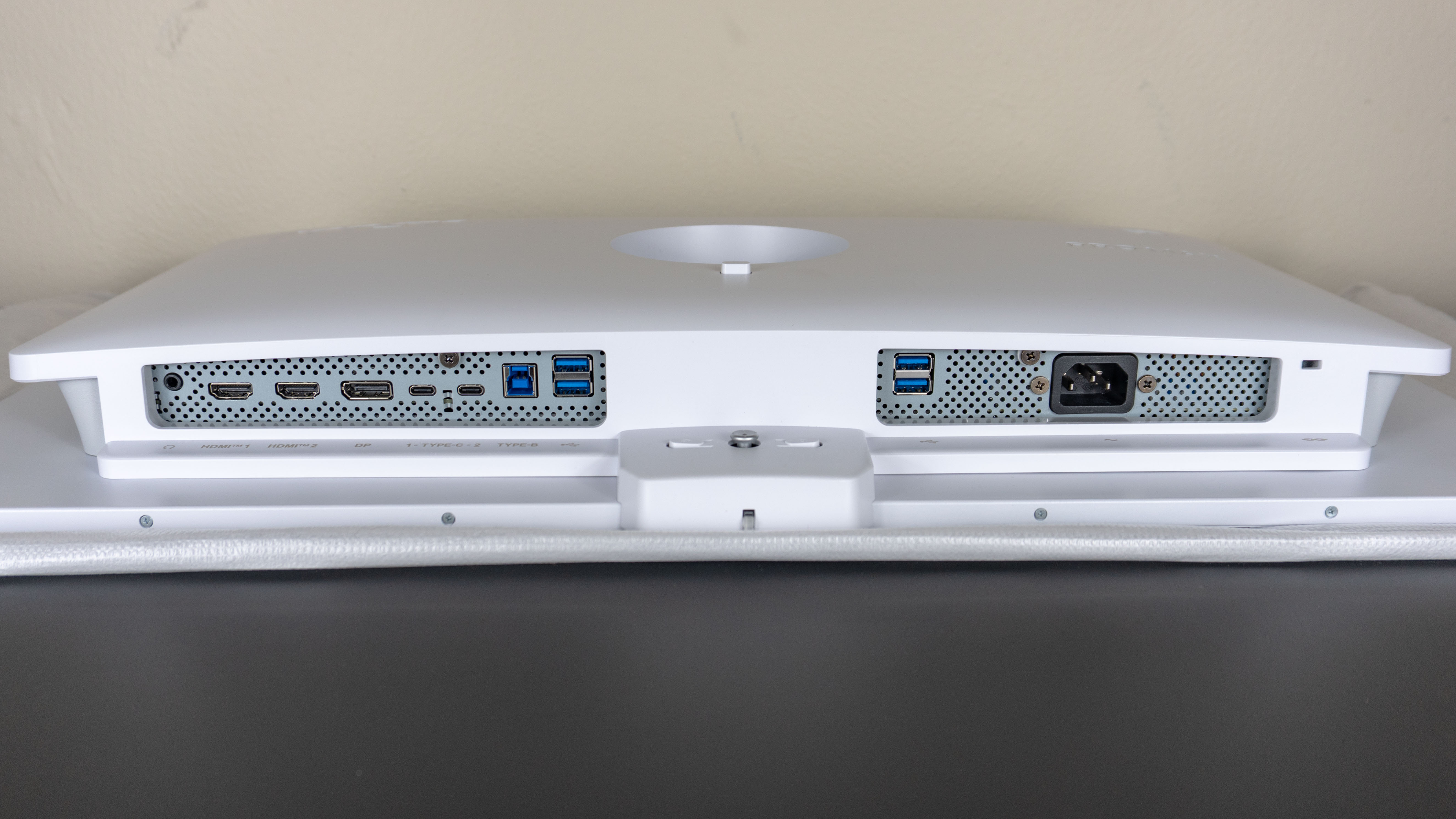 A wide shot showing off all of the ports on the underside of the MSI Pro Max 271UPXW12G monitor