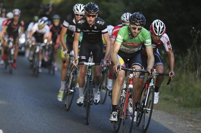 Neil Van Der Ploeg in the sprinters jersey out the front.