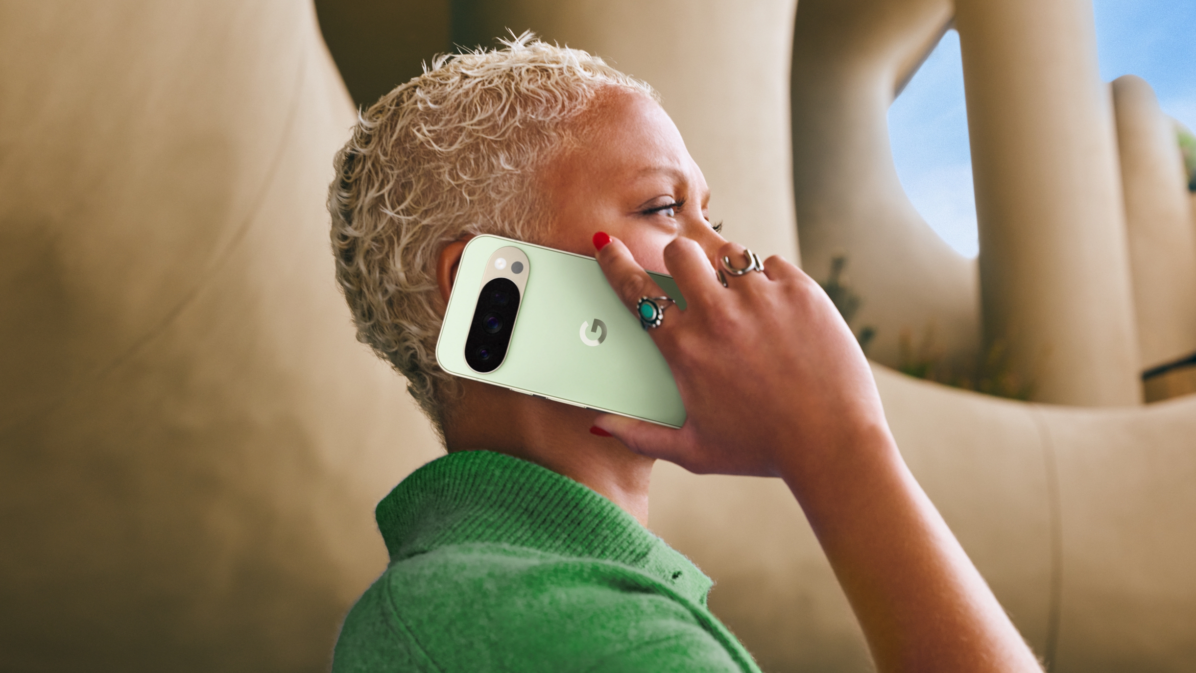 Person making a phone call on a Google Pixel 10 cell phone